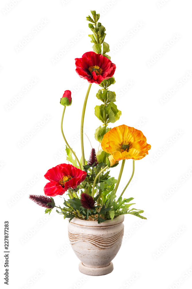 Floral arrangement from artificial poppy flowers in old ceramic flower pot. Floral arrangement from artificial poppy flowers in old ceramic flower pot.