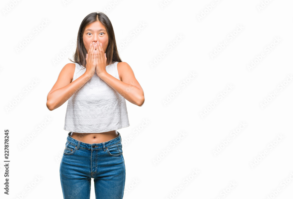 Young asian woman over isolated background shocked covering mouth with hands for mistake. Secret concept. Young asian woman over isolated background shocked covering mouth with hands for mistake. Secret concept.