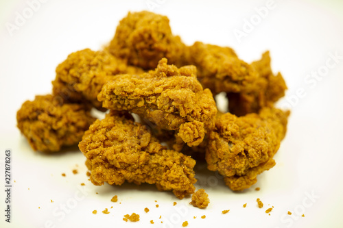 Delicious crispy fried chicken on a white background.