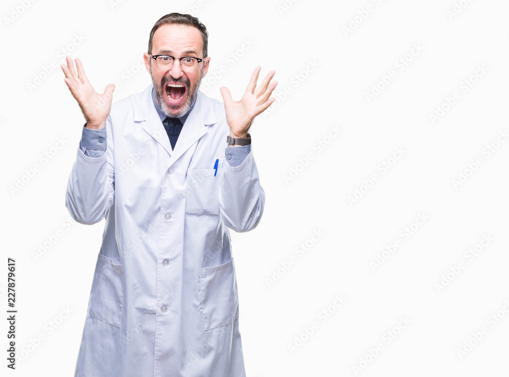 Middle age senior hoary professional man wearing white coat over isolated background celebrating crazy and amazed for success with arms raised and open eyes screaming excited. Winner concept Middle age senior hoary professional man wearing white coat over isolated background celebrating crazy and amazed for success with arms raised and open eyes screaming excited. Winner concept