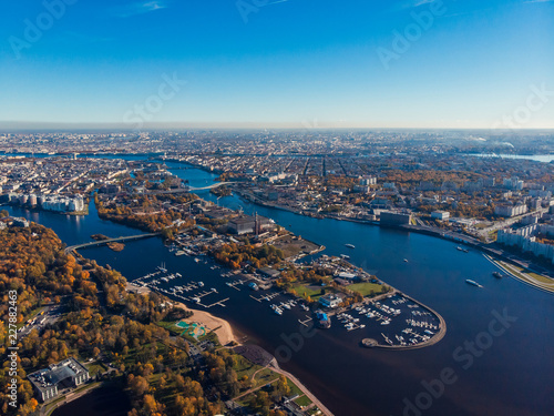 Krestovsky island in autumn colors. Bridges, yachts, ships. Elagin Palace. Central park. Urban landscape. Top view aerial drone .