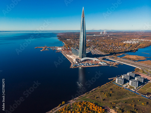 Saint Petersburg, RUSSIA - OCTOBER 1, 2018: Skyscraper Lakhta center Gazprom headquarters. Gulf of Finland. Autumn Park area. New residential complex. Top view aerial drone photo