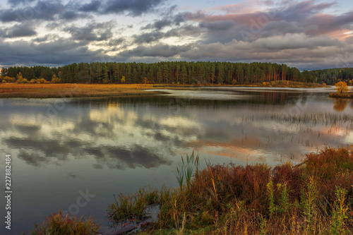 Picturesque autumn landscape of Russian nature at sunset.
