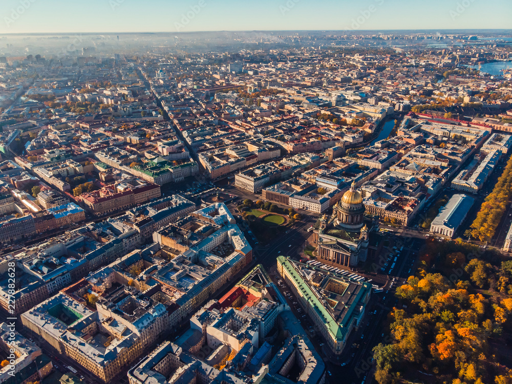Obraz premium Urban landscape of Saint-Petersburg. Air view St. Isaac Cathedral, streets and water canals .