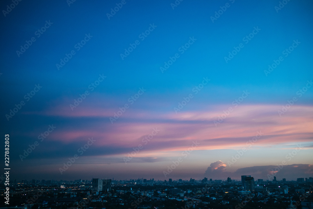 Colorful sky sunset over cityscape.