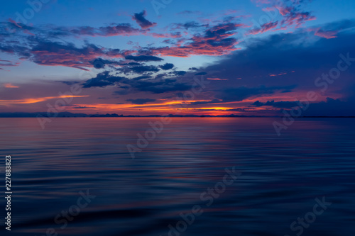 Sunset sky on the lake © noppharat
