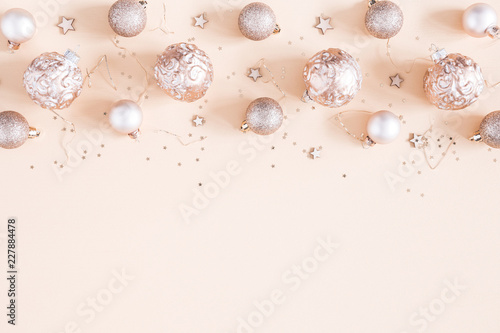Christmas composition. Christmas decorations on pastel beige background. Flat lay, top view, copy space