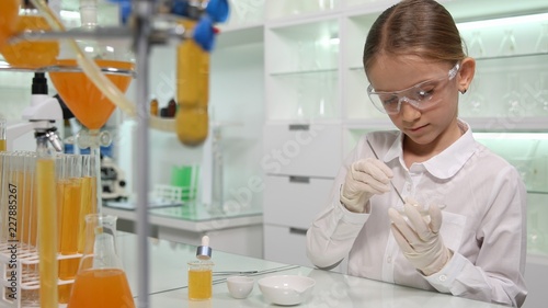 Child Making Chemical Experiment in School Lab  Student Girl in Science Class
