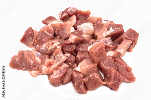 Pieces of sliced raw meat isolated on white background