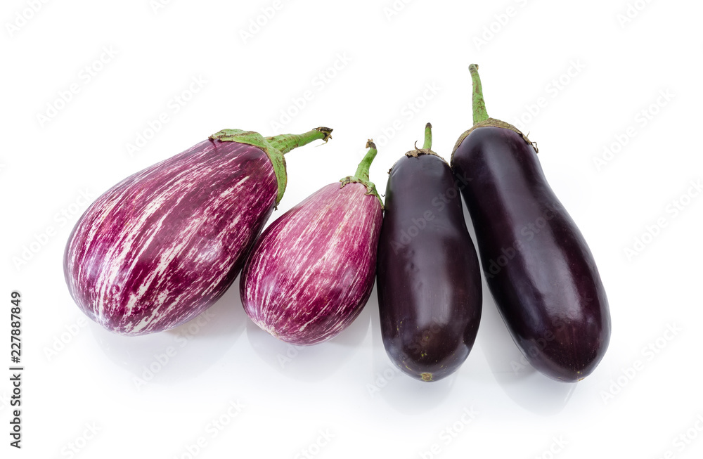 Uncooked purple conventional and Graffiti eggplants on a white background Uncooked purple conventional and Graffiti eggplants on a white background