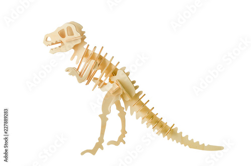 Tyrannosaurus skeleton wooden puzzle toy isolated on white background with clipping path