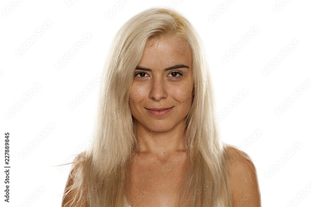 Portrait of young beautiful blonde woman with no makeup on white backgeound Portrait of young beautiful blonde woman with no makeup on white backgeound