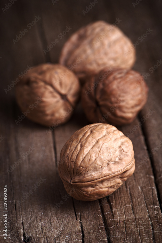 group of nuts on natural wood board group of nuts on natural wood board