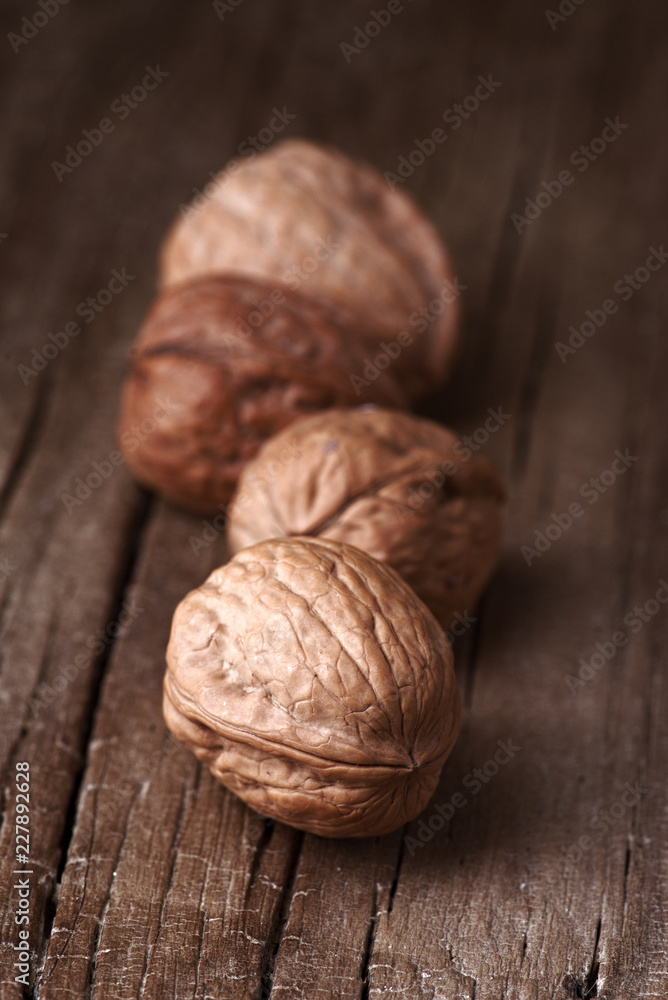 group of nuts on natural wood board group of nuts on natural wood board