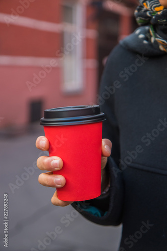 red cup of coffee to go