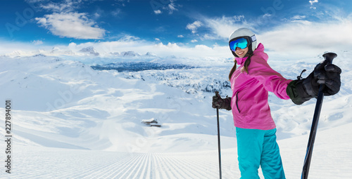 Young caucasian woman skier in European Alps