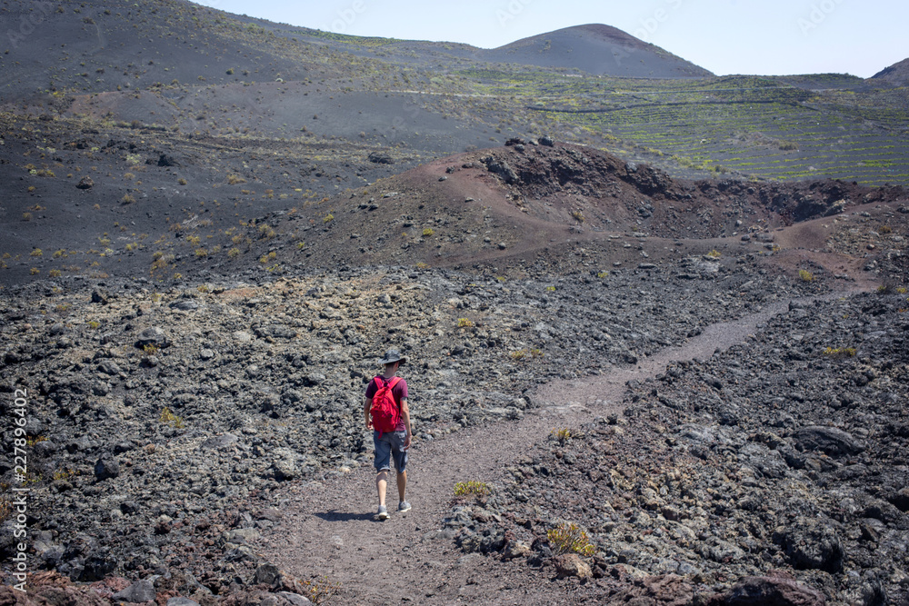 man walked between volcanoes