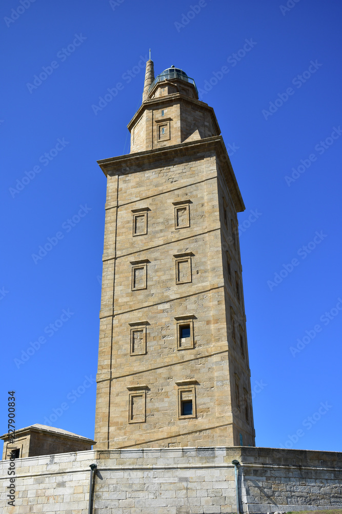 Torre de Hercules, roman lighthouse in use. La Coruña, Spain, blue sky.