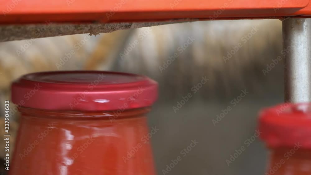 machinery cleaning tomato sauce bottles.Production of tomato sauce machinery cleaning tomato sauce bottles.Production of tomato sauce