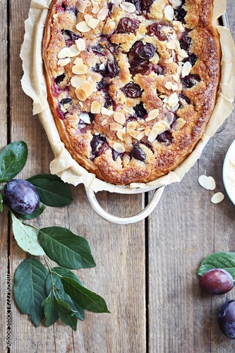 Plum cake. Spicy cake with plums, almond filling and cinnamon. Overhead view