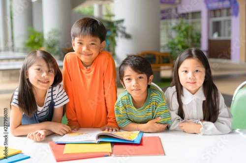 Asian Little Children Reading Book Cheerful