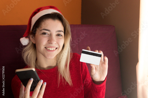 Girl paying online at Christmas photo