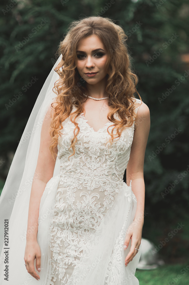 Bride. Beautiful young woman in the park on a warm summer day Bride. Beautiful young woman in the park on a warm summer day
