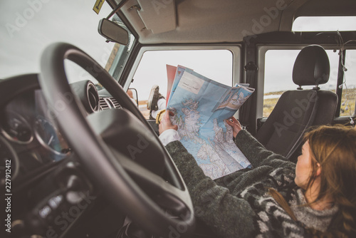 Woman looking at the map during the journey