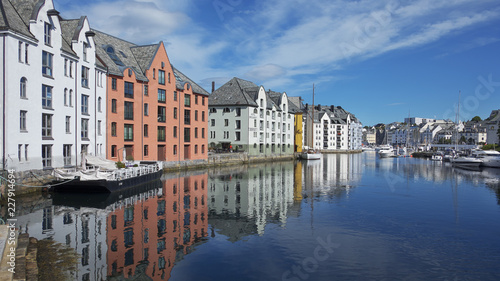 View of the famous clear blue canal lined up with the Art Nouveau buildings, the entire town being rebuilt in this architectural style after a terrific fire in 1904 , in Alesund, Norway