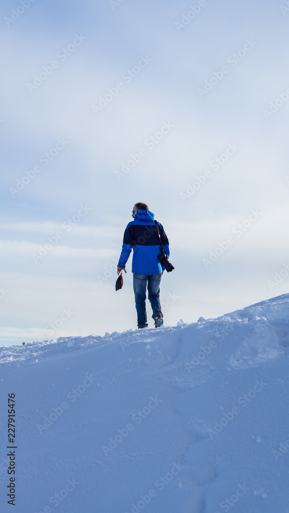 man on top of mountain