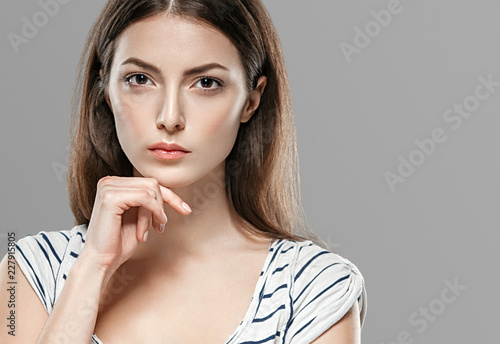 Beauty woman face hair skin healthy closeup over gray background