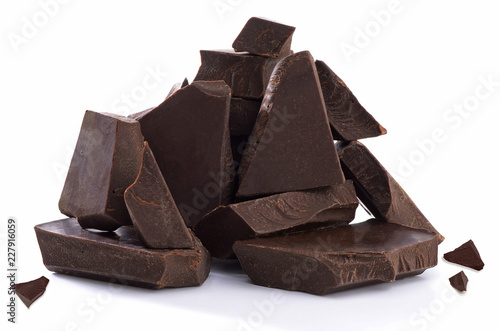 Broken chocolate blocks stack pile isolated on white background