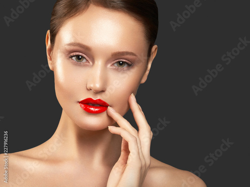 Makeup, cosmetics. Beauty young woman portrait. Beautiful model girl with beauty makeup, red lips, perfect fresh skin. Attractive lady with green eyes. Youth and Skin Care Concept