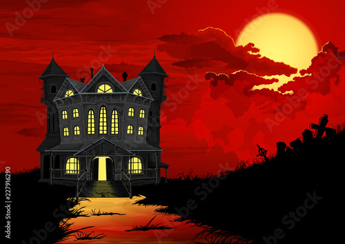Halloween background. Haunted house with lighted windows, on right side silhouette of graveyard. On the sky big full moon behind blood red clouds.
