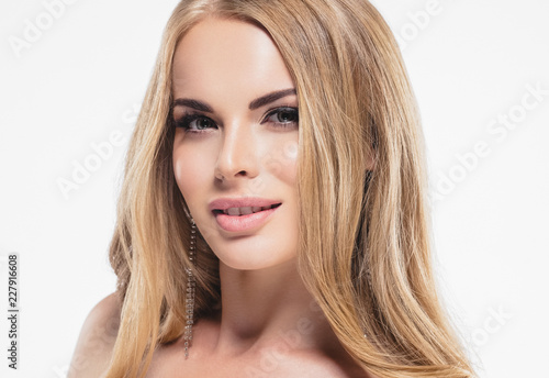Blonde woman beautifu; eyes and makeup cosmetic concept beauty lips and hairstyle