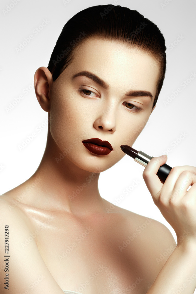 Fashion & beauty. Beautiful young woman with wine lipstick. Bune Fashion & beauty. Beautiful young woman with wine lipstick. Bune