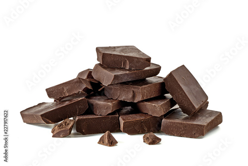 Broken chocolate blocks or pieces stack pile isolated on white background