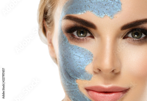 Woman with cosmetic scrab mask on face. photo