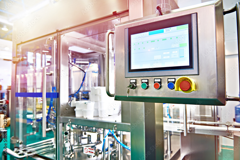Fototapeta premium Control panel monitor on conveyor at food factory for packing