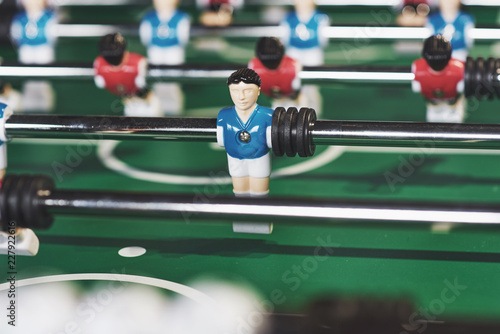 Table football in the entertainment center. Close-up image of plastic players in a football game © standret