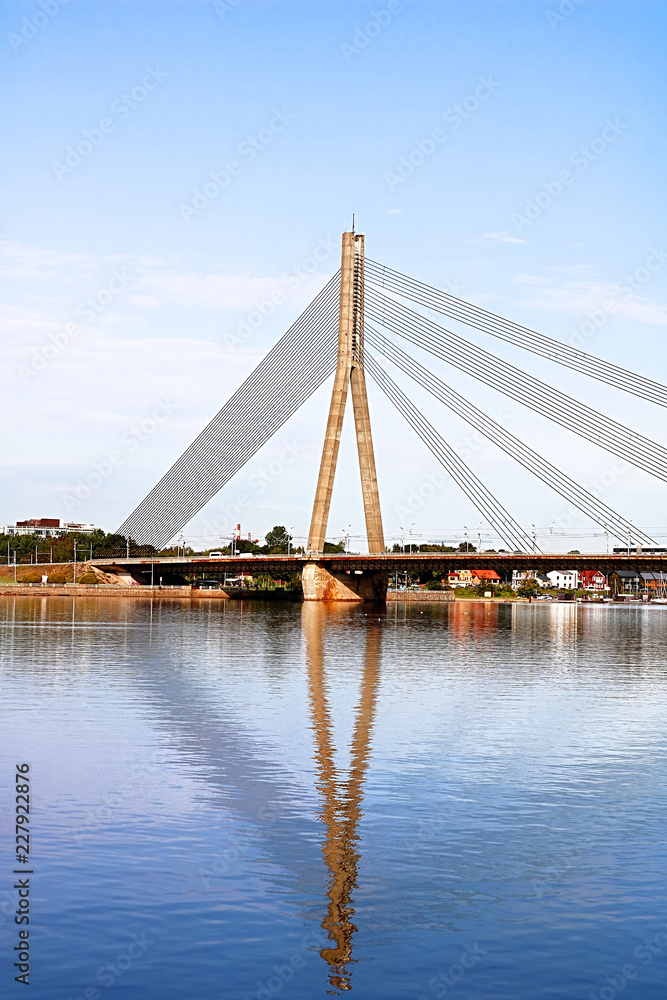 Obraz premium The Vansu Bridge in Riga is a cable-stayed bridge that crosses the Daugava river in Riga, Latvia