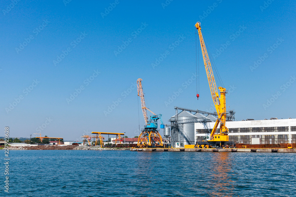 Port cranes in Burgas harbor. Summer day