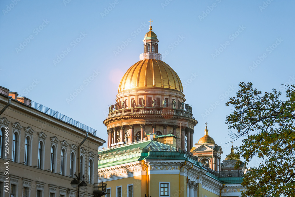 The dome of St. Isaac's Cathedral over other historical buildings in the city of St. Petersburg.