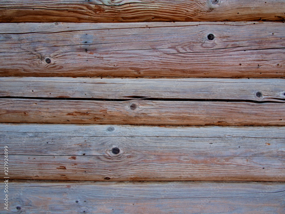 Obraz premium a fragment of the wall of the old house of logs