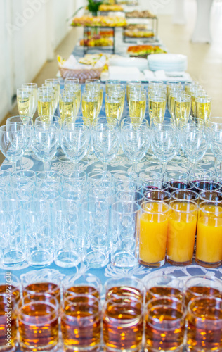 food background. many glasses with juice and champagne on buffet table