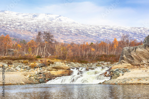 Fall in Norway, the view of the waterfall at the lake Gjevillvatnet located in the mountain area Trollheimen