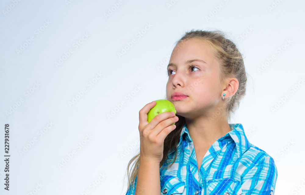 Kid girl eat green apple fruit. Nutritional content of apple. Vitamin nutrition concept. Reasons eat apple every day. Apple a day keeps doctor away. Good nutrition is essential to good health Kid girl eat green apple fruit. Nutritional content of apple. Vitamin nutrition concept. Reasons eat apple every day. Apple a day keeps doctor away. Good nutrition is essential to good health