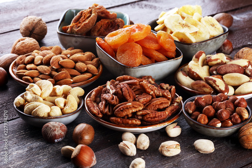 Fototapeta Naklejka Na Ścianę i Meble -  dried fruits and assorted nuts composition on rustic table