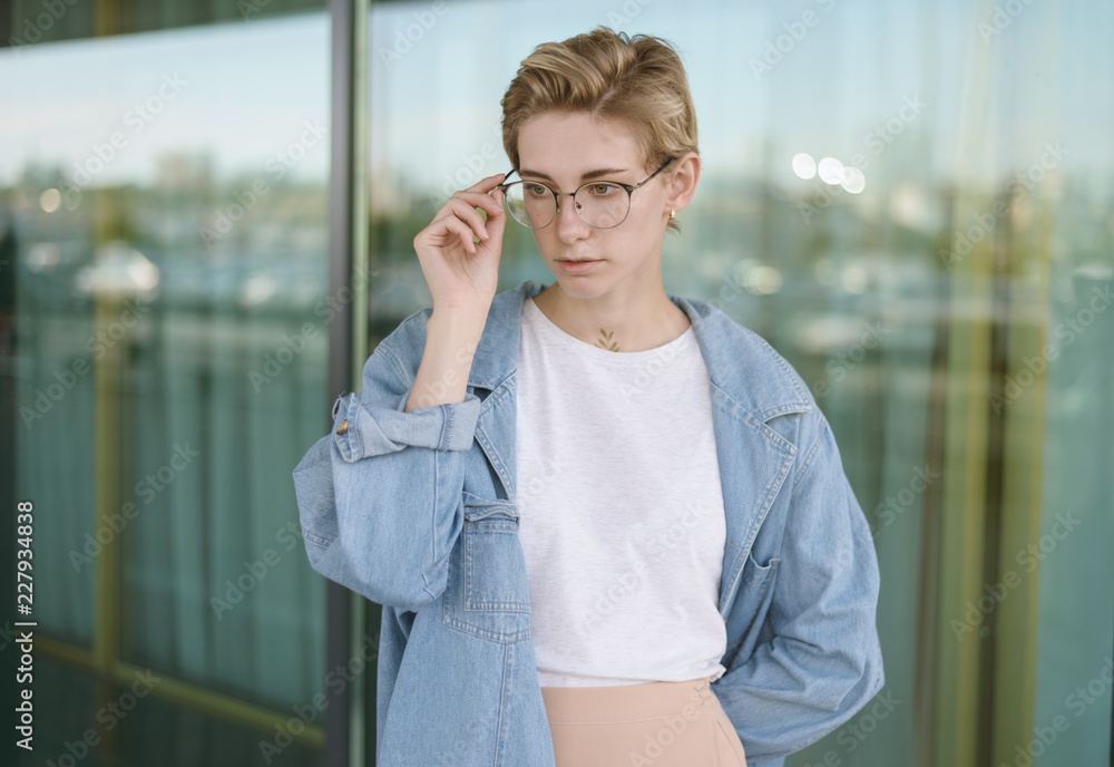 Portrait of beautiful young woman wearing glasses.