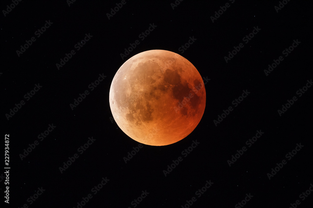 Full bloody moon eclispse on black sky background